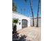 Private gated entrance flanked by palm trees and desert landscaping at 3416 N 44Th St # 70, Phoenix, AZ 85018