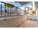 Exterior patio area features table with chairs, black railings and cracked concrete at 3416 N 44Th St # 70, Phoenix, AZ 85018