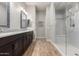 Bathroom featuring double vanity and glass enclosed shower with tiled accents at 3519 E Appaloosa Rd, Gilbert, AZ 85296