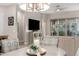 Bright dining room featuring wood-look tile flooring and a modern chandelier at 3519 E Appaloosa Rd, Gilbert, AZ 85296