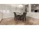 Cozy dining area with decorative chairs, modern light fixture, and wood-look tile floors at 3519 E Appaloosa Rd, Gilbert, AZ 85296