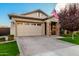 Inviting home with brick driveway, front porch with stone pillars, and a neat lawn at 3519 E Appaloosa Rd, Gilbert, AZ 85296