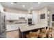 Updated kitchen featuring stainless appliances, white cabinets, and modern lighting at 3519 E Appaloosa Rd, Gilbert, AZ 85296