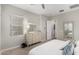 Bright main bedroom with dresser, mirror, and ensuite entrance at 3519 E Appaloosa Rd, Gilbert, AZ 85296