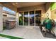 Covered patio area with complete outdoor kitchen set up and large sliding glass doors at 3519 E Appaloosa Rd, Gilbert, AZ 85296