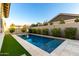 Backyard swimming pool with artificial turf and landscaping for privacy at 3519 E Appaloosa Rd, Gilbert, AZ 85296