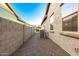 Long narrow side yard with gravel, block wall and an air conditioner at 3519 E Appaloosa Rd, Gilbert, AZ 85296