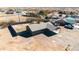 Aerial view of the home showcasing its layout, fencing, and surrounding desert landscape at 3545 N Hohokam Dr, Eloy, AZ 85131