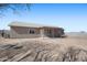 A view of the backyard, showcasing the home's exterior features and spacious outdoor area at 3545 N Hohokam Dr, Eloy, AZ 85131