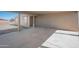 Beige concrete carport with supporting columns, a concrete floor, and two windows at 3545 N Hohokam Dr, Eloy, AZ 85131