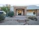 Close up of the front of the home featuring a stone archway and fountain at 35530 N Canyon Crossings Dr, Cave Creek, AZ 85331