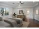 Light, bright main bedroom featuring hardwood floors, neutral paint, ensuite access and natural light at 35530 N Canyon Crossings Dr, Cave Creek, AZ 85331