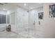 Large glass enclosed shower with a bench and dual shower heads at 35530 N Canyon Crossings Dr, Cave Creek, AZ 85331