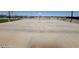 Outdoor basketball court with concrete flooring for recreational play in a community setting at 36825 W San Clemente St, Maricopa, AZ 85138