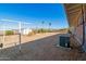 The expansive backyard has desert landscaping, a shed for storage, palm trees and scenic mountain views at 417 W Sunset Dr, Mammoth, AZ 85618