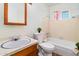 This bathroom features a vanity sink, a toilet with decorative plant, and a shower with tub combo at 417 W Sunset Dr, Mammoth, AZ 85618