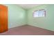 Bright bedroom with neutral walls and a large window at 417 W Sunset Dr, Mammoth, AZ 85618