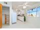 Bright kitchen with white cabinets, ceiling fans, a closet, and natural light from a window at 417 W Sunset Dr, Mammoth, AZ 85618