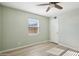 Bright bedroom featuring a ceiling fan and a large window at 4235 N 16Th Dr, Phoenix, AZ 85015