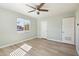 Bedroom with ceiling fan, wood-look flooring, and natural light at 4235 N 16Th Dr, Phoenix, AZ 85015