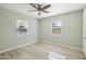 Bright bedroom with light wood-look flooring and two large windows at 4235 N 16Th Dr, Phoenix, AZ 85015