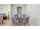 Dining area featuring a glass-top table, gray chairs, and stylish decor at 4235 N 16Th Dr, Phoenix, AZ 85015