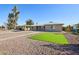 Well-maintained single-story home with gravel yard and mature tree at 4235 N 16Th Dr, Phoenix, AZ 85015