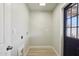 Bright laundry room featuring wood-look floors and utility connections at 4235 N 16Th Dr, Phoenix, AZ 85015