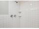 Modern tiled walk-in shower features chrome fixtures and built-in shelves at 4235 N 16Th Dr, Phoenix, AZ 85015