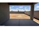 Covered patio area looking out to a spacious backyard, offering potential for outdoor enjoyment at 4513 W 95Th Dr, Tolleson, AZ 85353