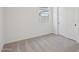 Cozy bedroom featuring soft carpeting and a bright window for natural light at 4513 W 95Th Dr, Tolleson, AZ 85353