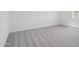 Light-filled bedroom showcasing clean carpet floors, white walls, and a bright atmosphere at 4513 W 95Th Dr, Tolleson, AZ 85353