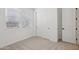 Bedroom featuring carpet flooring, closet, and natural light at 4513 W 95Th Dr, Tolleson, AZ 85353