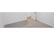 Comfortable bedroom with carpet flooring and an entrance to another room at 4513 W 95Th Dr, Tolleson, AZ 85353