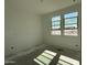 Sunlit bedroom with two large windows offers a bright and airy space ready for personalized touches at 4513 W 95Th Dr, Tolleson, AZ 85353
