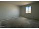 Bedroom features a window for natural light and ample open space for furniture at 4513 W 95Th Dr, Tolleson, AZ 85353