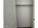 A clean, white reach-in closet with ample space for storage and organization at 4513 W 95Th Dr, Tolleson, AZ 85353