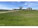 Lush green community park featuring a covered playground at 4513 W 95Th Dr, Tolleson, AZ 85353