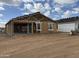 Framing of the exterior of a partially completed home showing the framing and roofing structure under construction at 4513 W 95Th Dr, Tolleson, AZ 85353