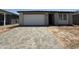 Charming single-story home with a brick driveway and a white garage door, offering a welcoming curb appeal at 4513 W 95Th Dr, Tolleson, AZ 85353