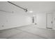 Open garage space with ample storage and a large door to fit your vehicles at 4513 W 95Th Dr, Tolleson, AZ 85353