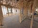 Framing of a partially constructed interior featuring wall studs, concrete flooring and electrical boxes at 4513 W 95Th Dr, Tolleson, AZ 85353