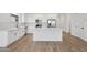 Beautiful kitchen featuring stainless steel appliances, an island and white cabinets at 4513 W 95Th Dr, Tolleson, AZ 85353