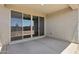 Inviting covered patio with sliding glass doors providing seamless indoor-outdoor living at 4513 W 95Th Dr, Tolleson, AZ 85353