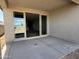 Covered patio area with sliding glass doors, ideal for indoor-outdoor living at 4513 W 95Th Dr, Tolleson, AZ 85353