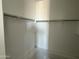 Spacious walk-in closet features shelving, closet rod and ample storage space at 4513 W 95Th Dr, Tolleson, AZ 85353