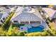 Aerial view of the house highlighting the pool, patio, and landscaping; solar panels are also visible on the roof at 4675 S Bandit Rd, Gilbert, AZ 85297