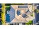 Aerial view of home showcasing the pool, fire pit, putting green, solar panels, and unique architectural details at 4675 S Bandit Rd, Gilbert, AZ 85297