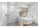 Bright bathroom featuring walk-in shower, soaking tub, and elegant tile work at 4675 S Bandit Rd, Gilbert, AZ 85297