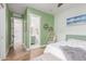 Bright bedroom with green walls and decor with a hanging swing chair at 4675 S Bandit Rd, Gilbert, AZ 85297